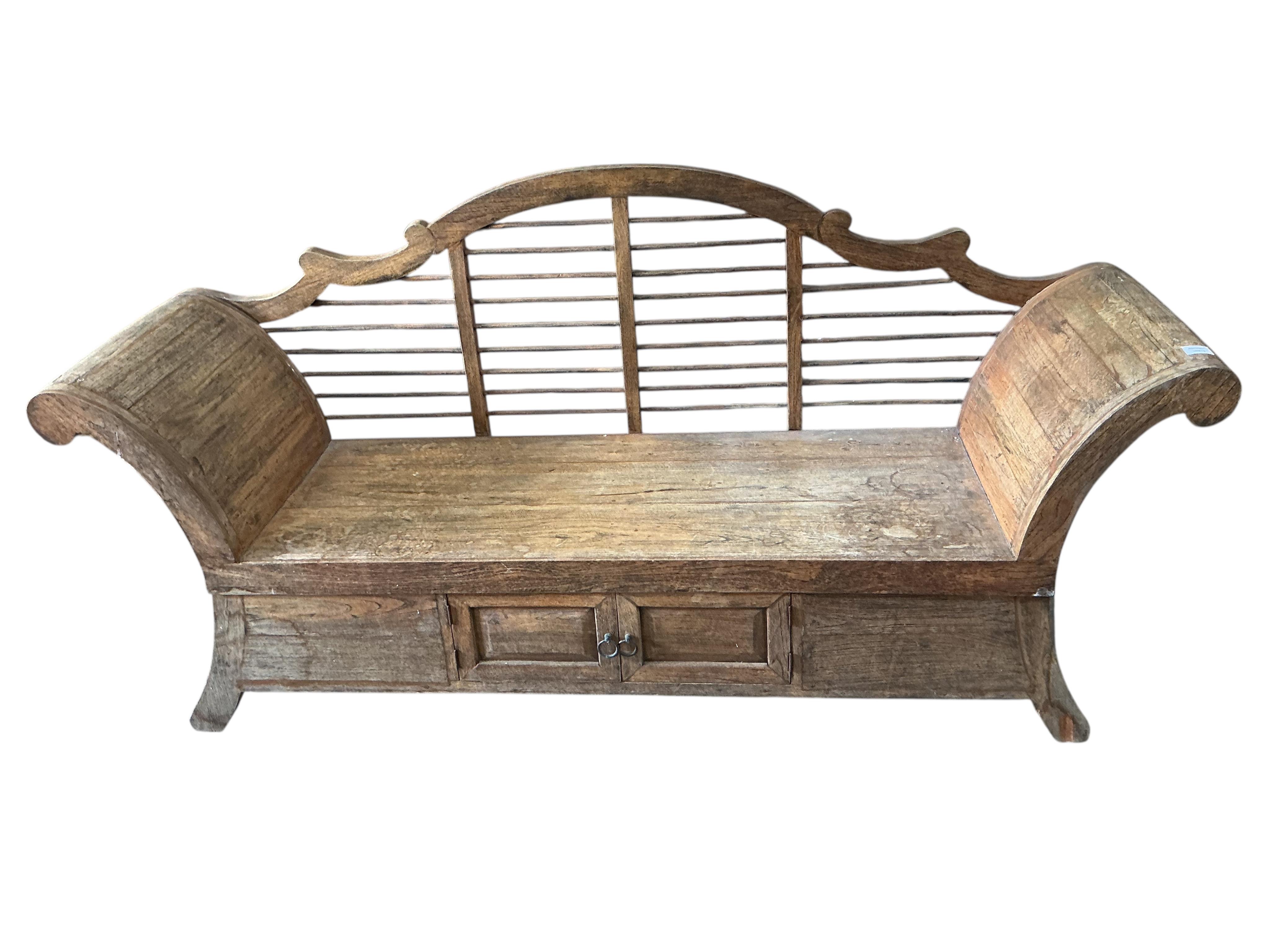 A Burmese hardwood settee, width 189cm, depth 54cm, height 93cm